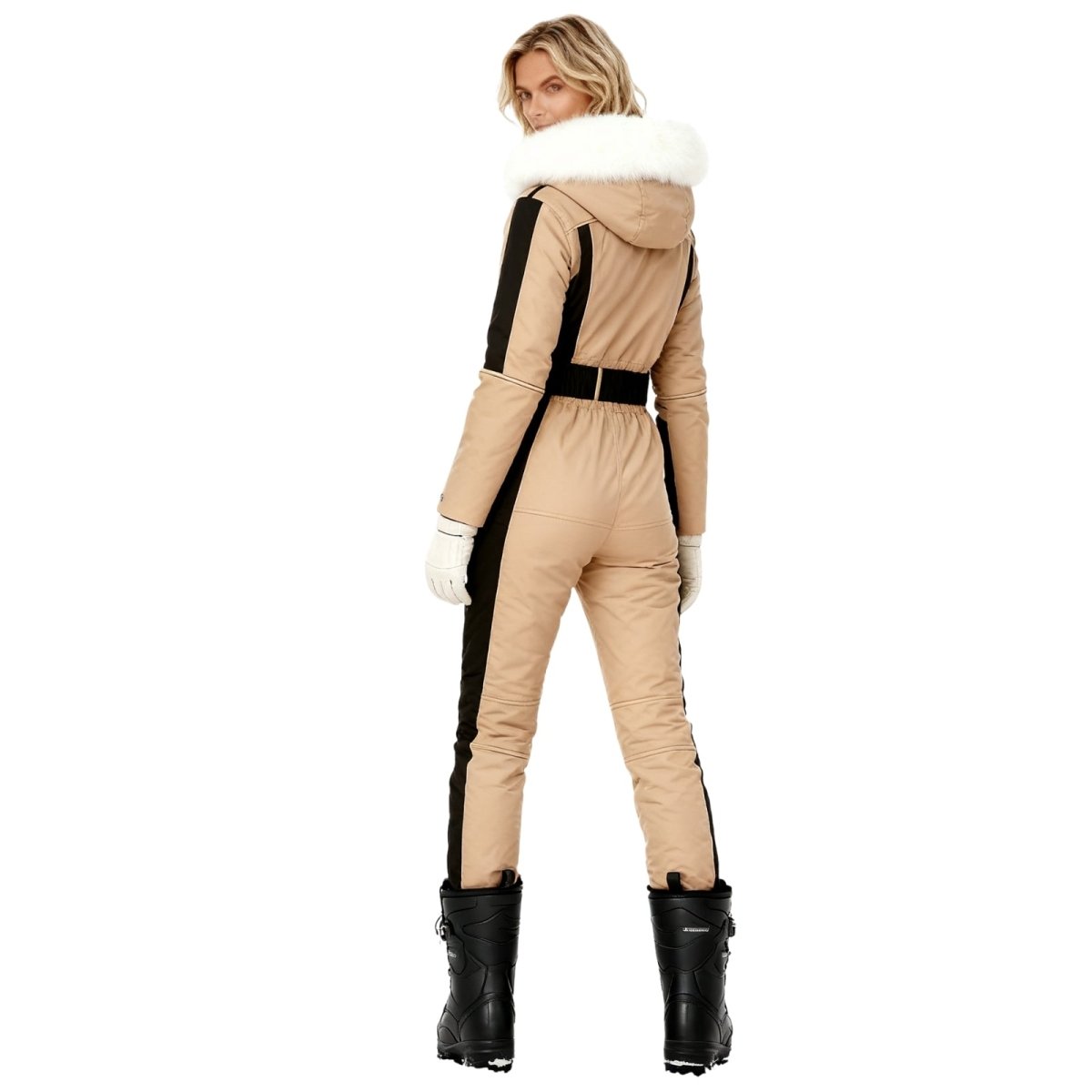 Person wearing a khaki and black kouvr snowsuit with white fur trim on a white background