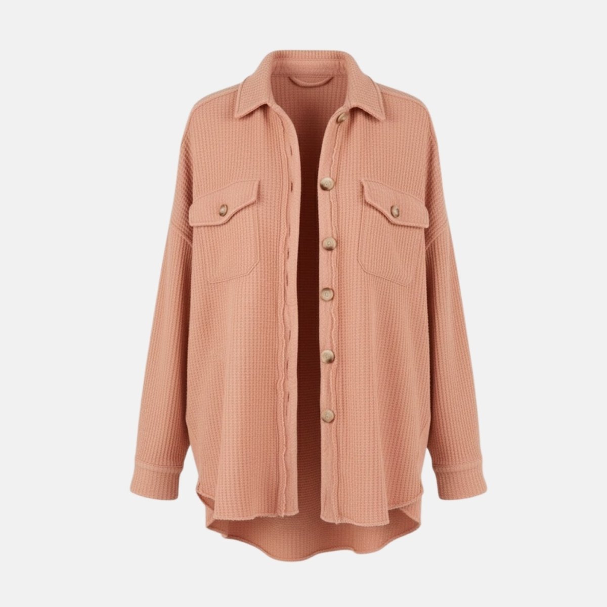 Flat lay product shot of the Kouvr Donna shacket in apricot, showing the waffle texture, chest pockets, and button front.