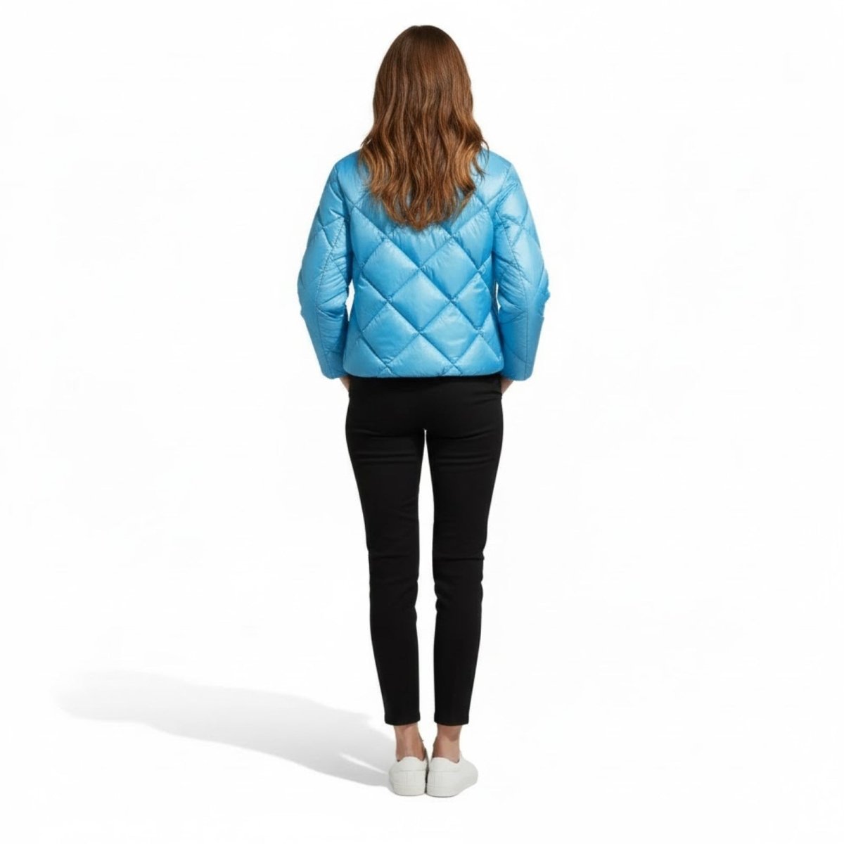 Back view of a model wearing the Kouvr Elisse sky blue diamond quilted puffer jacket.