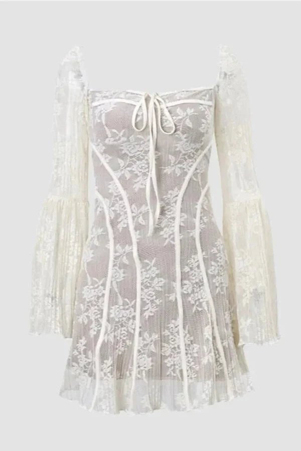 Model wearing the black Kouvr Elysia lace corset mini dress with long bell sleeves against a white background.
