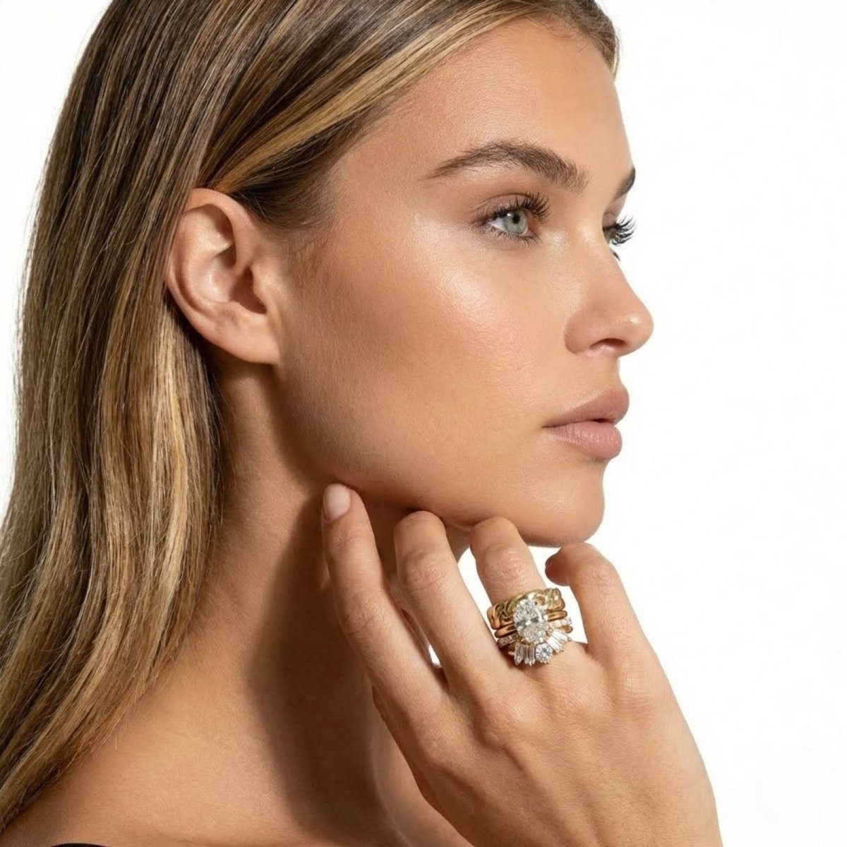 Side view of the Kouvr Emersyn diamond ring stack on a model's finger, highlighting the layers and intricate design of the multi-band set.