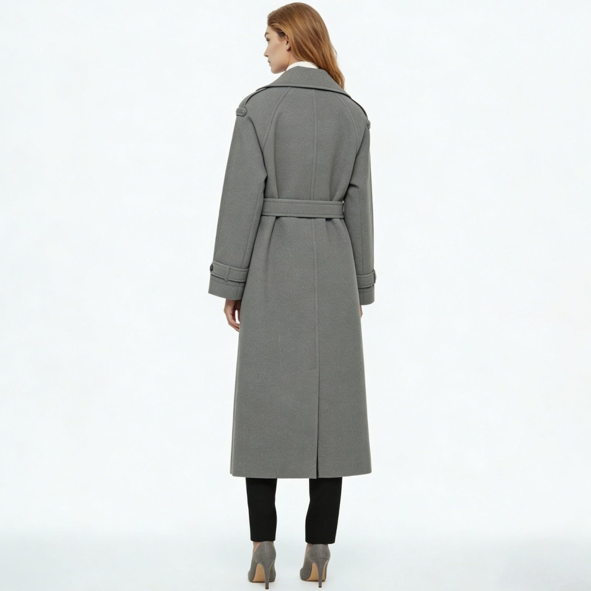 Back view of the belted Kouvr Esther grey wool trench coat, highlighting the clean lines and center vent.