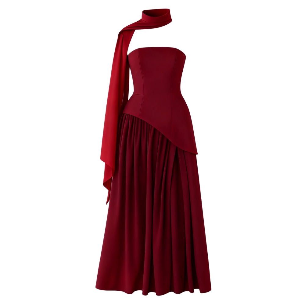 Burgundy Kouvr strapless gown with a draped design on a white background