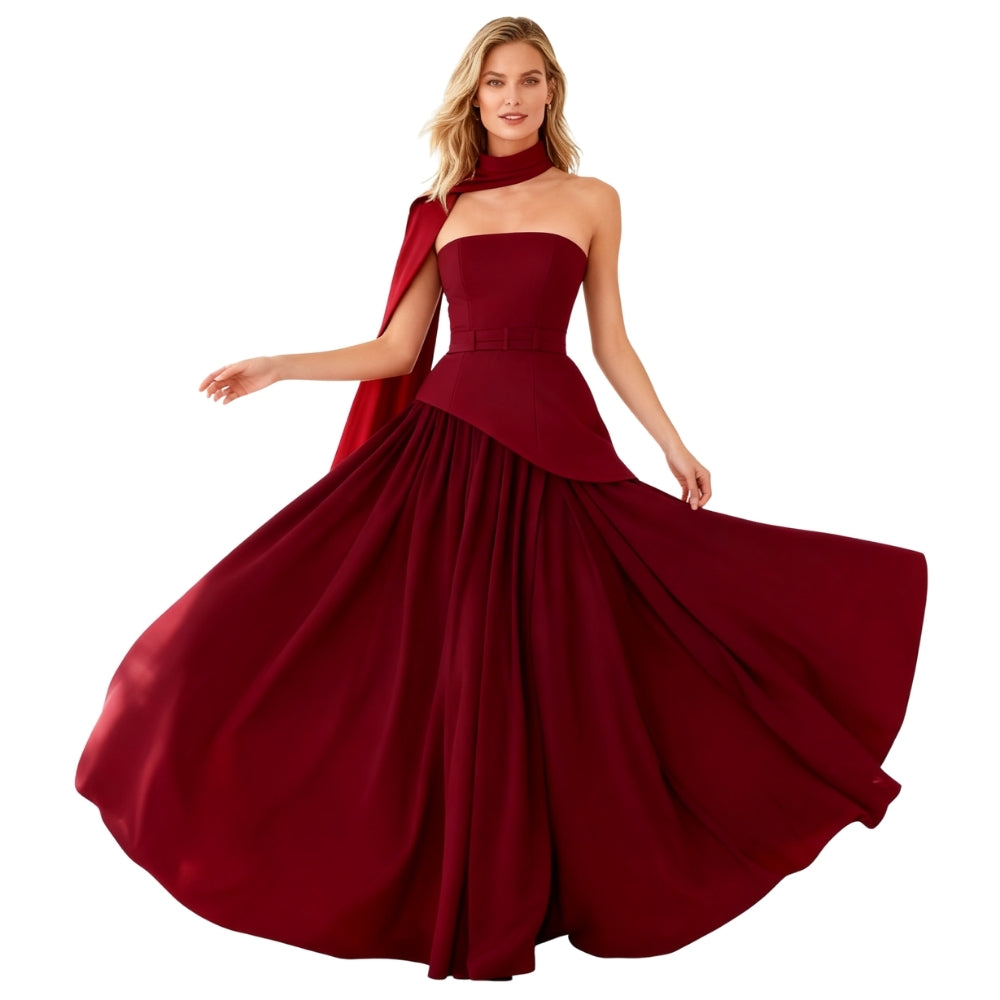 Woman wearing a burgundy Kouvr evening gown with a cape on a white background