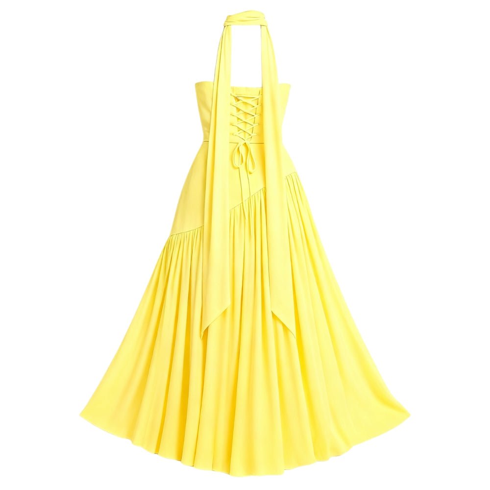 Yellow Kouvr dress with halter neck on a white background