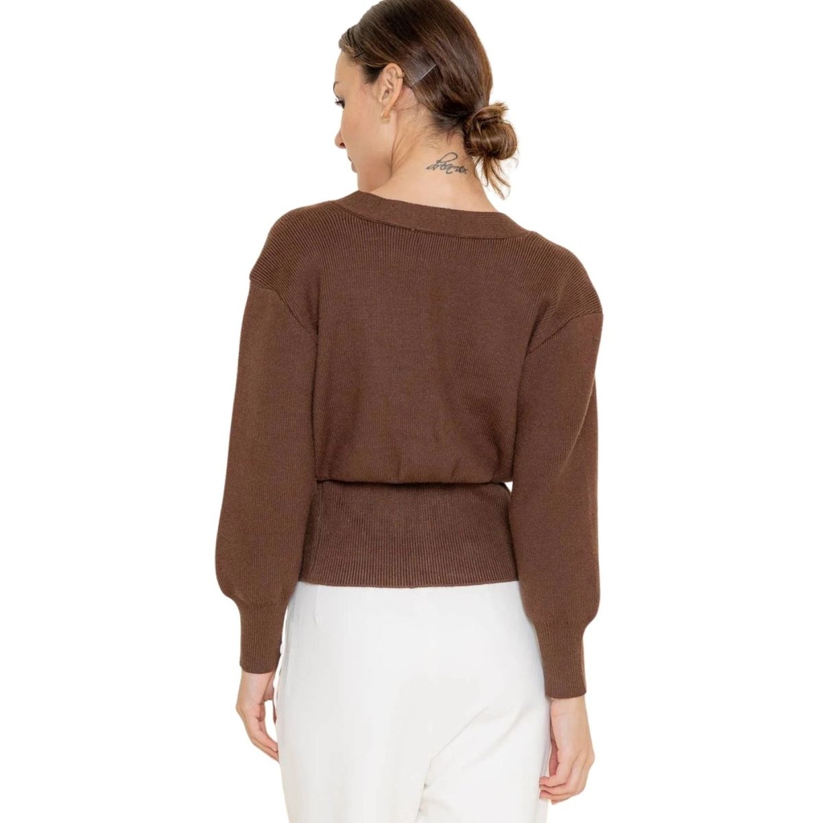 Back view of the Kouvr Avaline brown cropped cardigan showing the ribbed waistband detail.