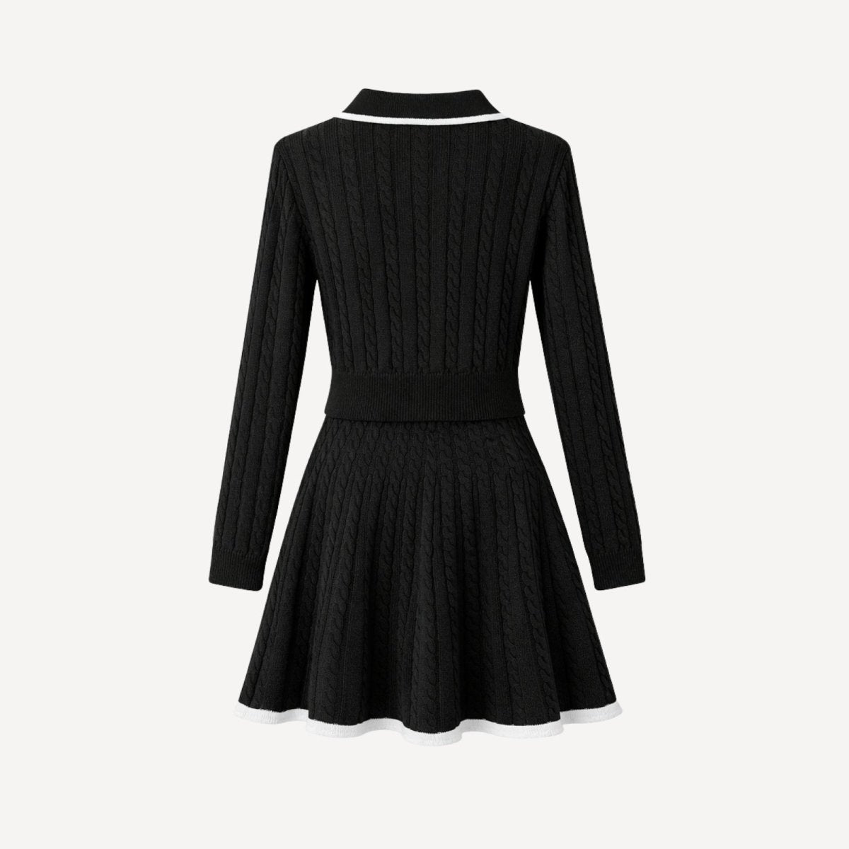 Back view flat lay of a black cable-knit A-line mini dress by Kouvr Fashion, showcasing the garment's structure and detail.