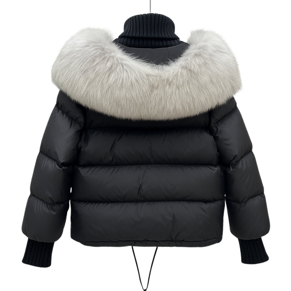 Black Kouvr puffer jacket with a large fur collar on a white background