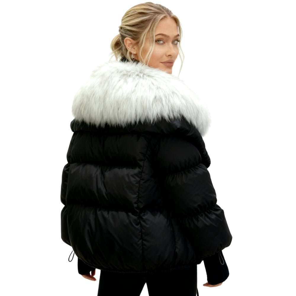 Black Kouvr puffer coat with white fur trim worn by a model on a white background