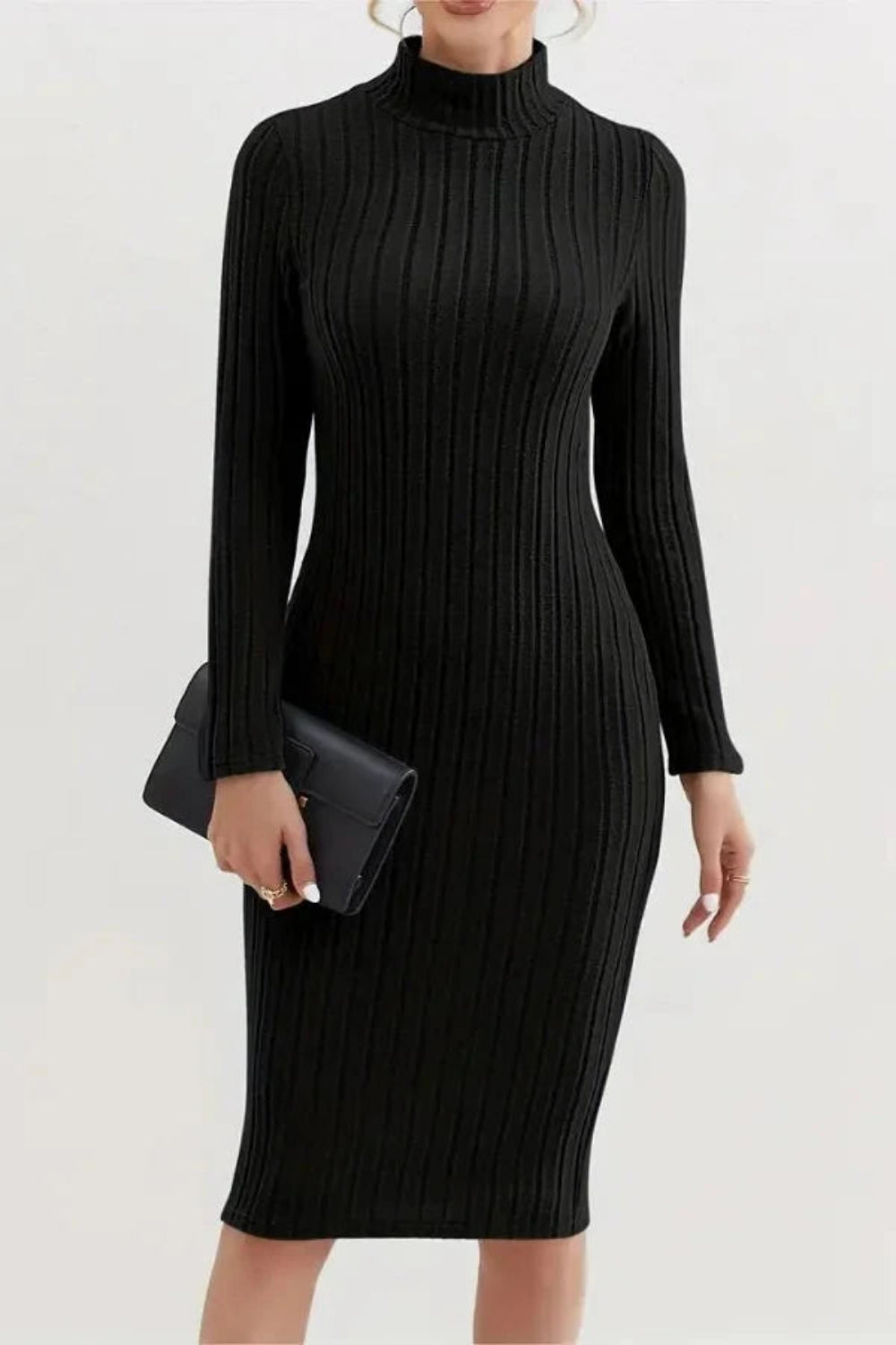 Model wearing the Kouvr Fashion long sleeve ribbed bodycon dress in black, holding a silver handbag