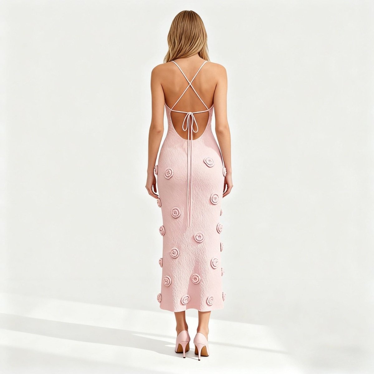 Pink kouvr dress with floral patterns on a white background