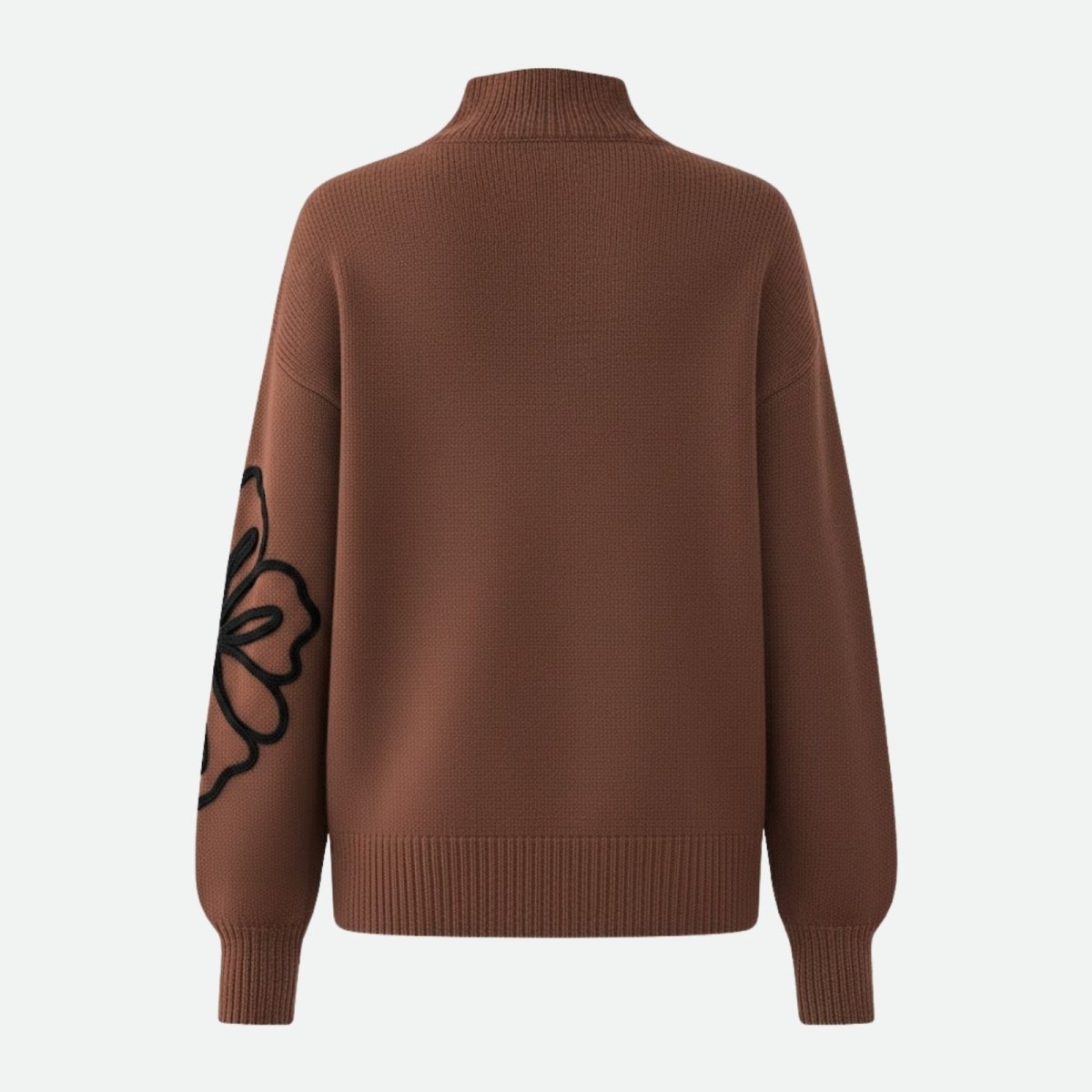 Product-only flatlay image of the back of the Kouvr Fashion brown sweater, detailing the knit pattern and embroidered flower on the sleeve.