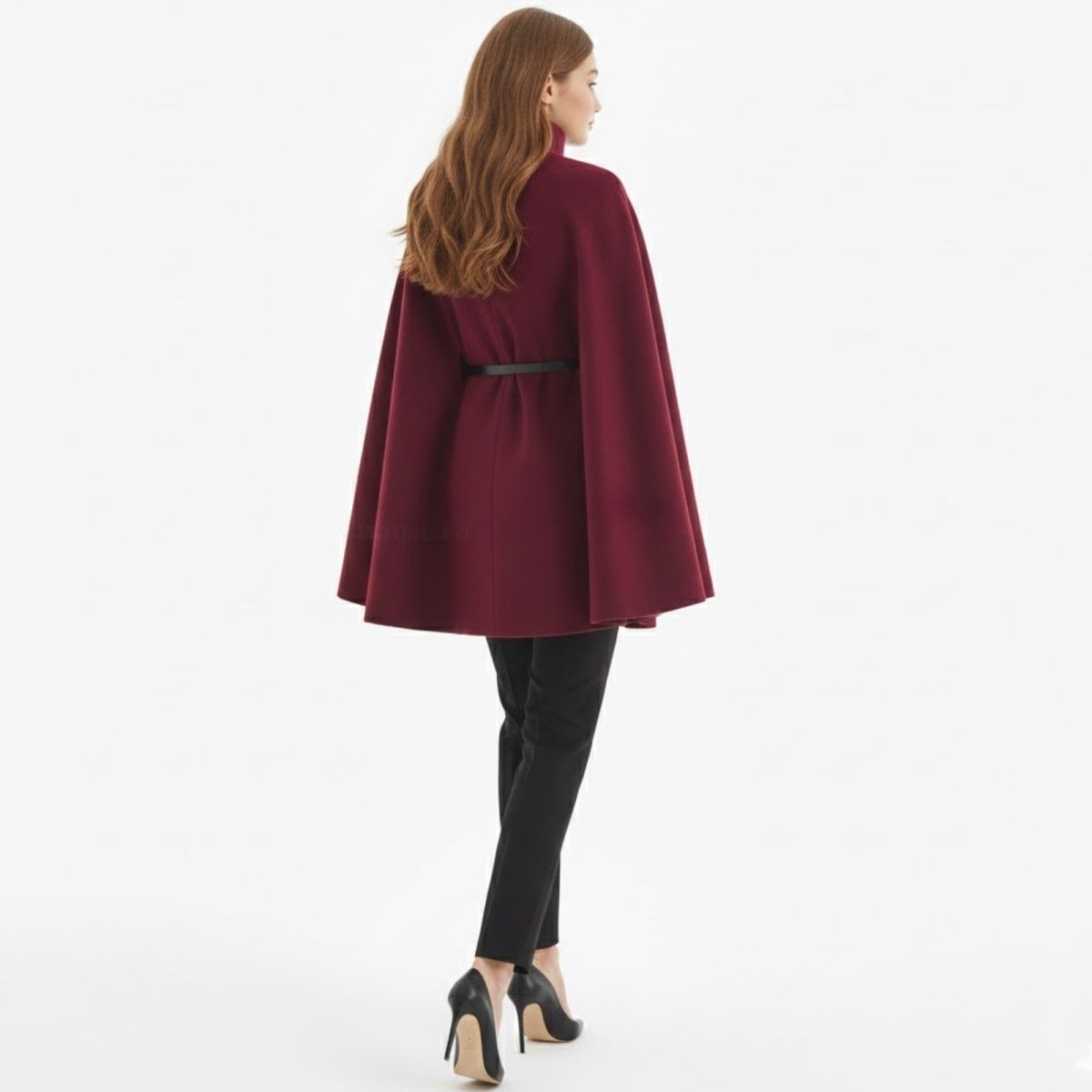 Back view of a model in the Kouvr Fashion burgundy belted cape coat, showcasing the A-line silhouette and belt detail.