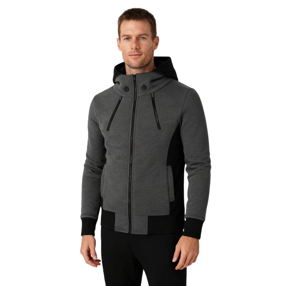 Man wearing a dark gray kouvr hooded jacket on a white background