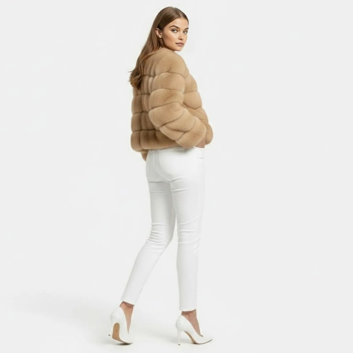 Back view of a woman wearing a sophisticated camel faux fur panelled jacket from Kouvr Fashion.