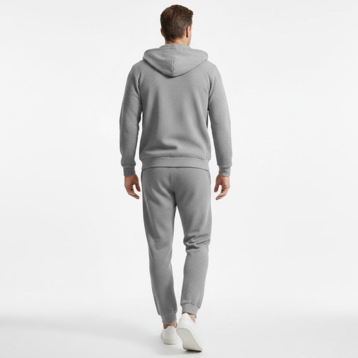Back view of the Kouvr Fashion men's grey waffle-knit hoodie and jogger set, highlighting the structure and clean lines of the loungewear.