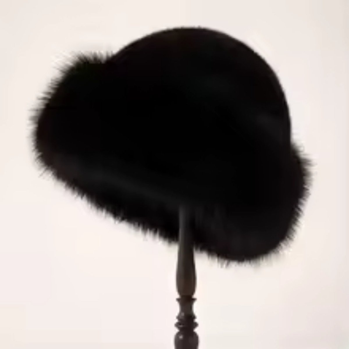 Black fur hat on a white background