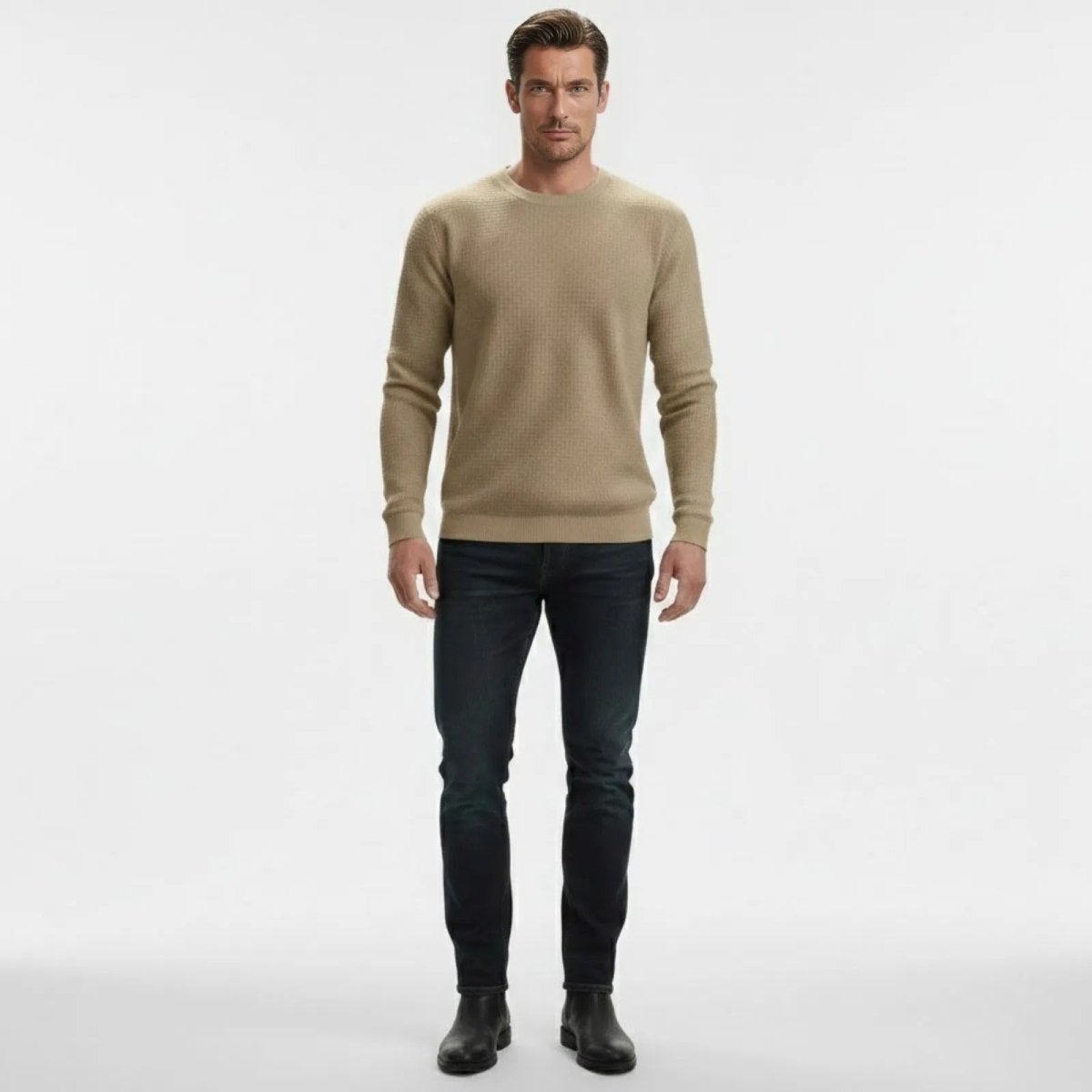 Man wearing The Colby khaki waffle-knit crewneck sweater from Kouvr Fashion with dark wash jeans and black boots, facing forward.