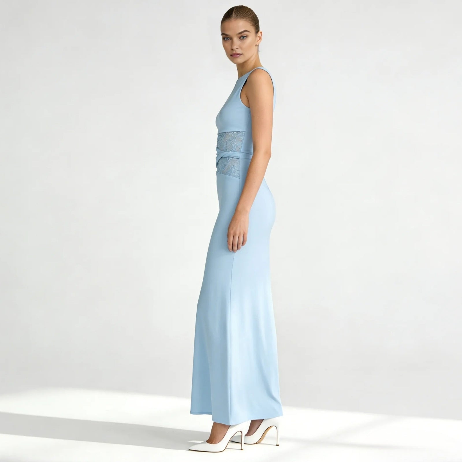 Side profile of the light blue Deborah formal gown, highlighting the sleek column silhouette and lace paneling at the waist.