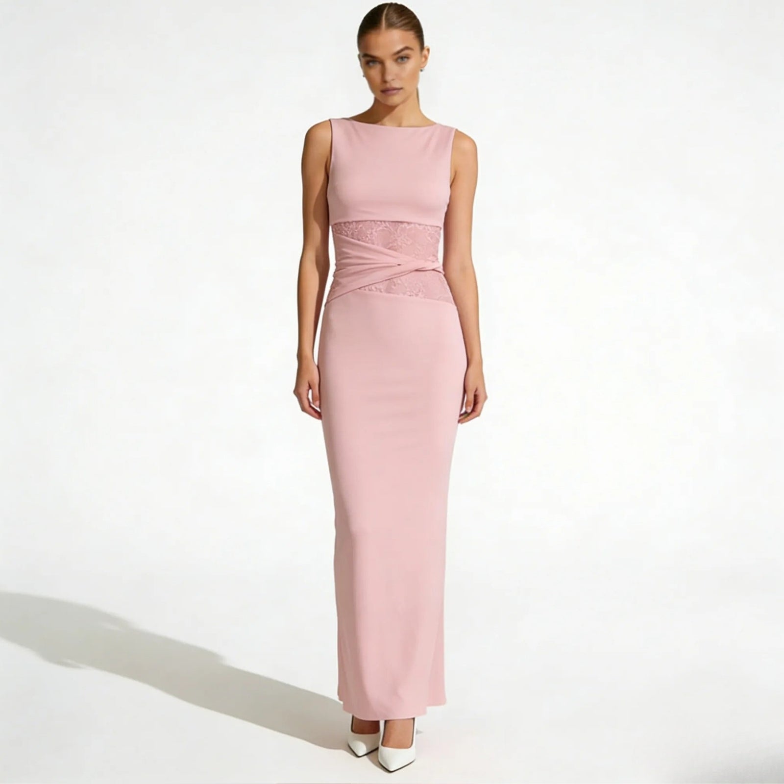 Model wearing the Kouvr Fashion deborah pink sleeveless formal gown with intricate lace waist detail, viewed from the front.