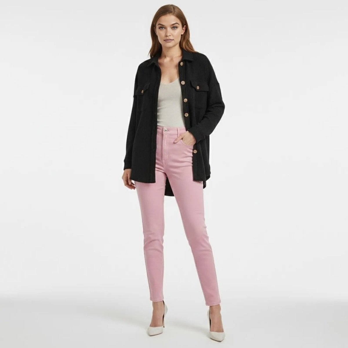 A woman models the Kouvr Fashion Donna Waffle Knit Shacket in black, styled open over a white top and pink trousers against a white background.
