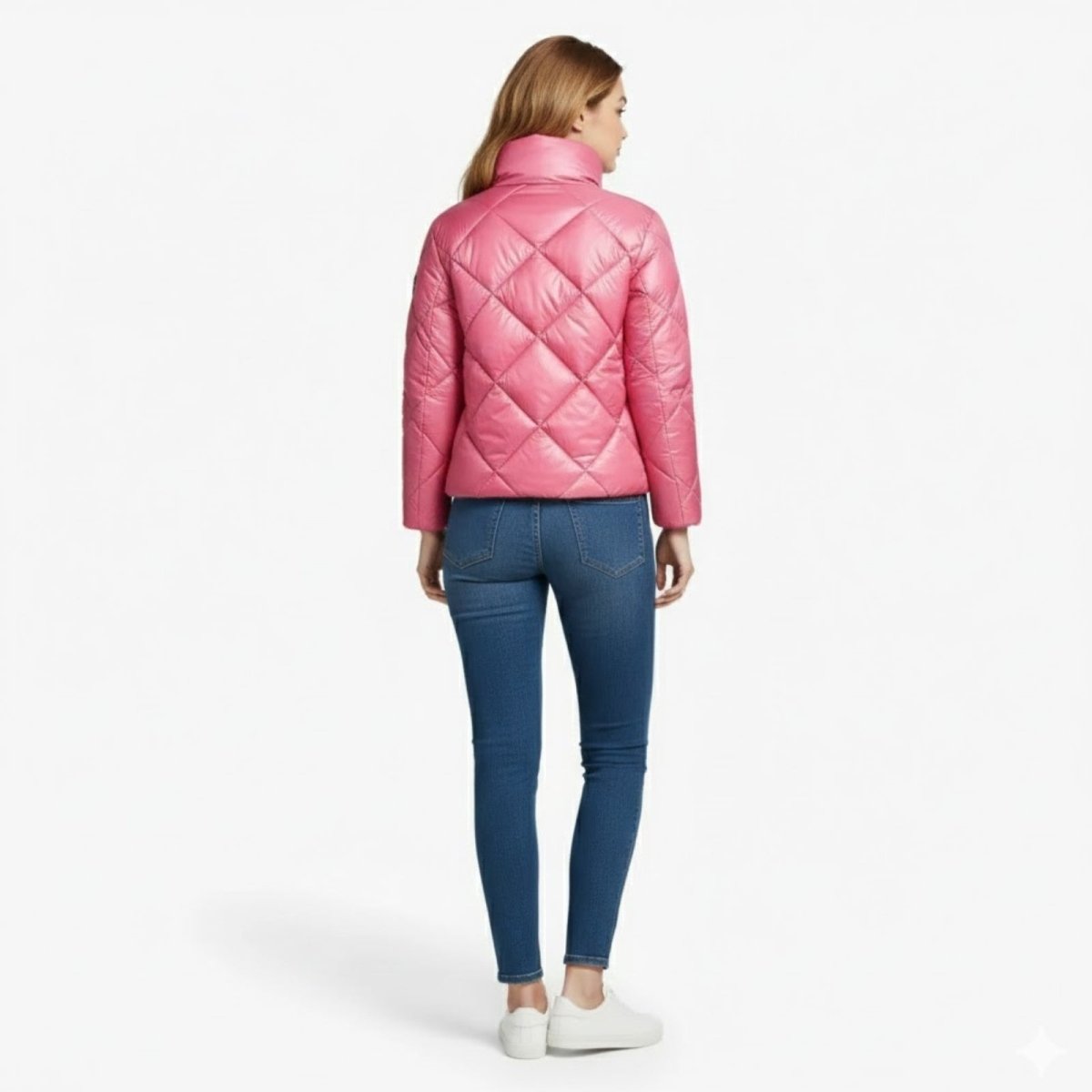 Back view of the pink diamond quilted Elisse Puffer Jacket by Kouvr Fashion, worn by a model to display the full pattern.