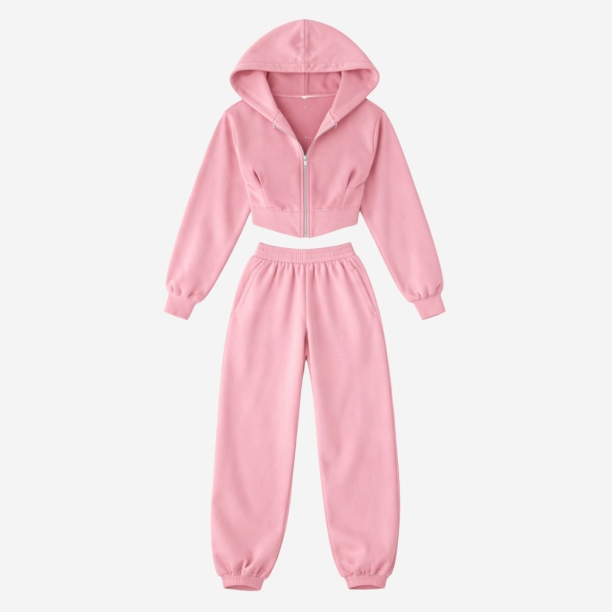 Flat lay of the pink cropped zip-up hoodie and matching joggers set by Kouvr Fashion.