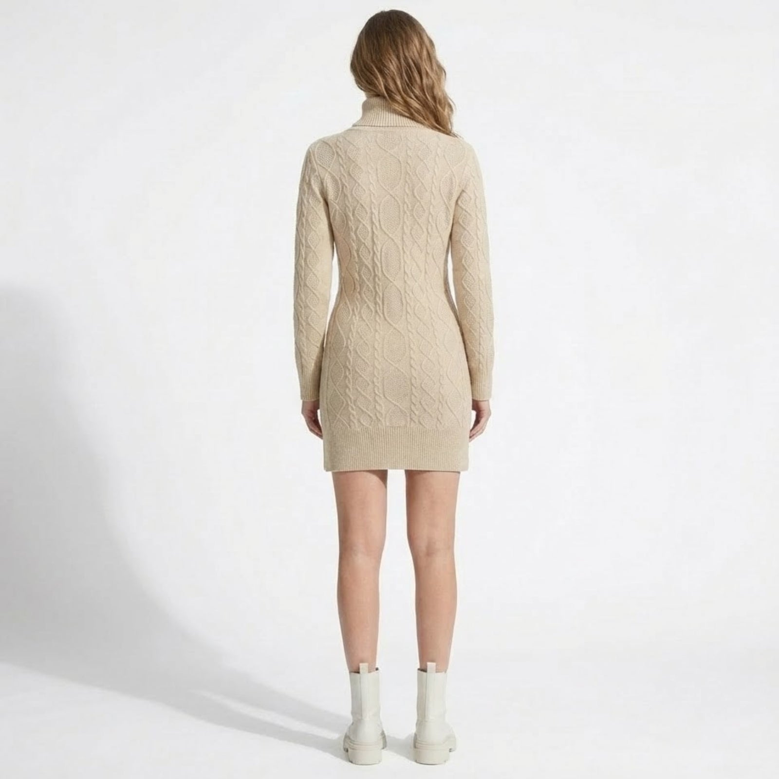 Back view of the Kouvr Fashion beige cable knit mini dress, showcasing the continuous Aran knit pattern down the back.