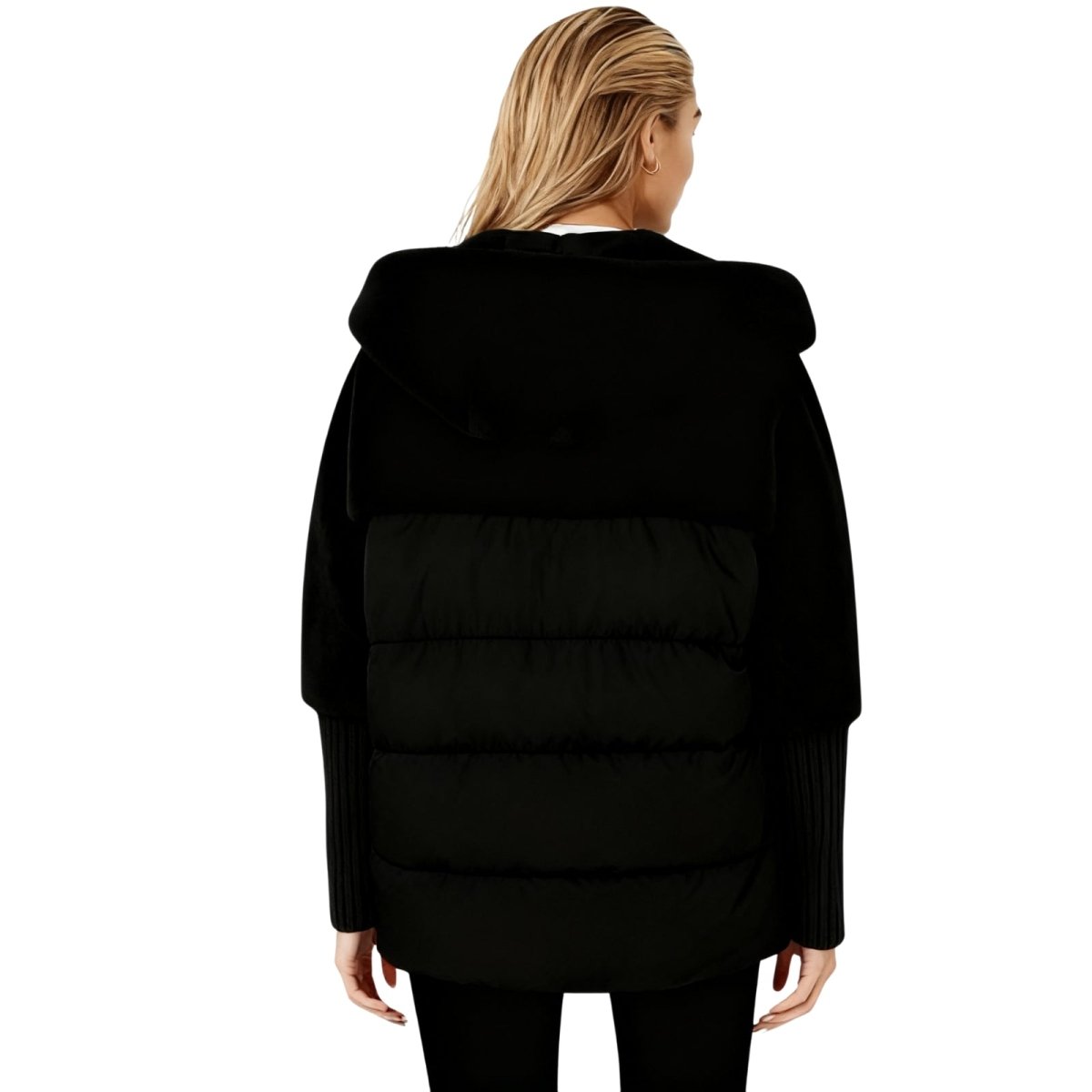 Black kouvr puffer jacket worn by a person on a white background