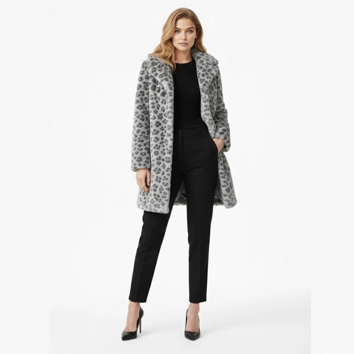 Model facing forward wearing the Kouvr Fashion gray leopard print faux fur coat with a black top and trousers.