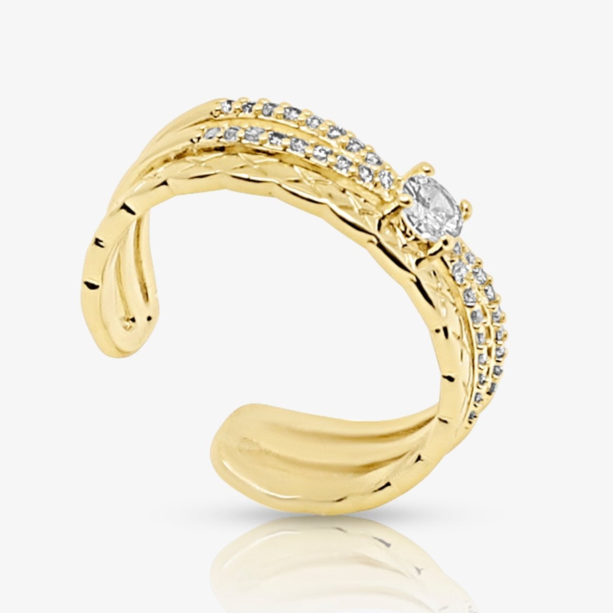Gold kouvr ring with diamond accents on a white background