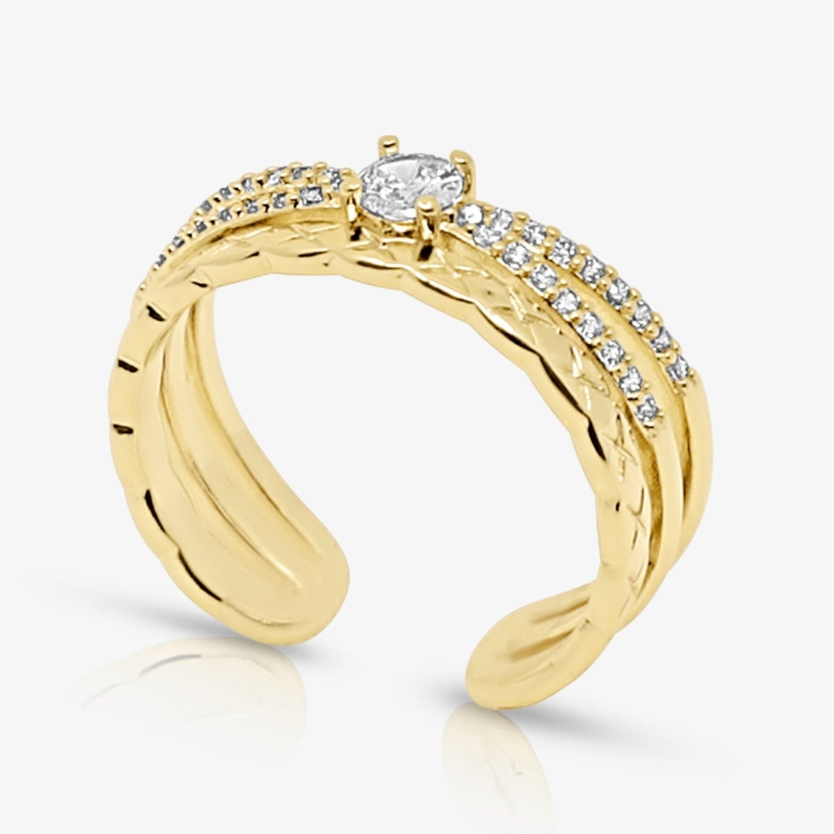 Gold kouvr ring with diamonds on a white background