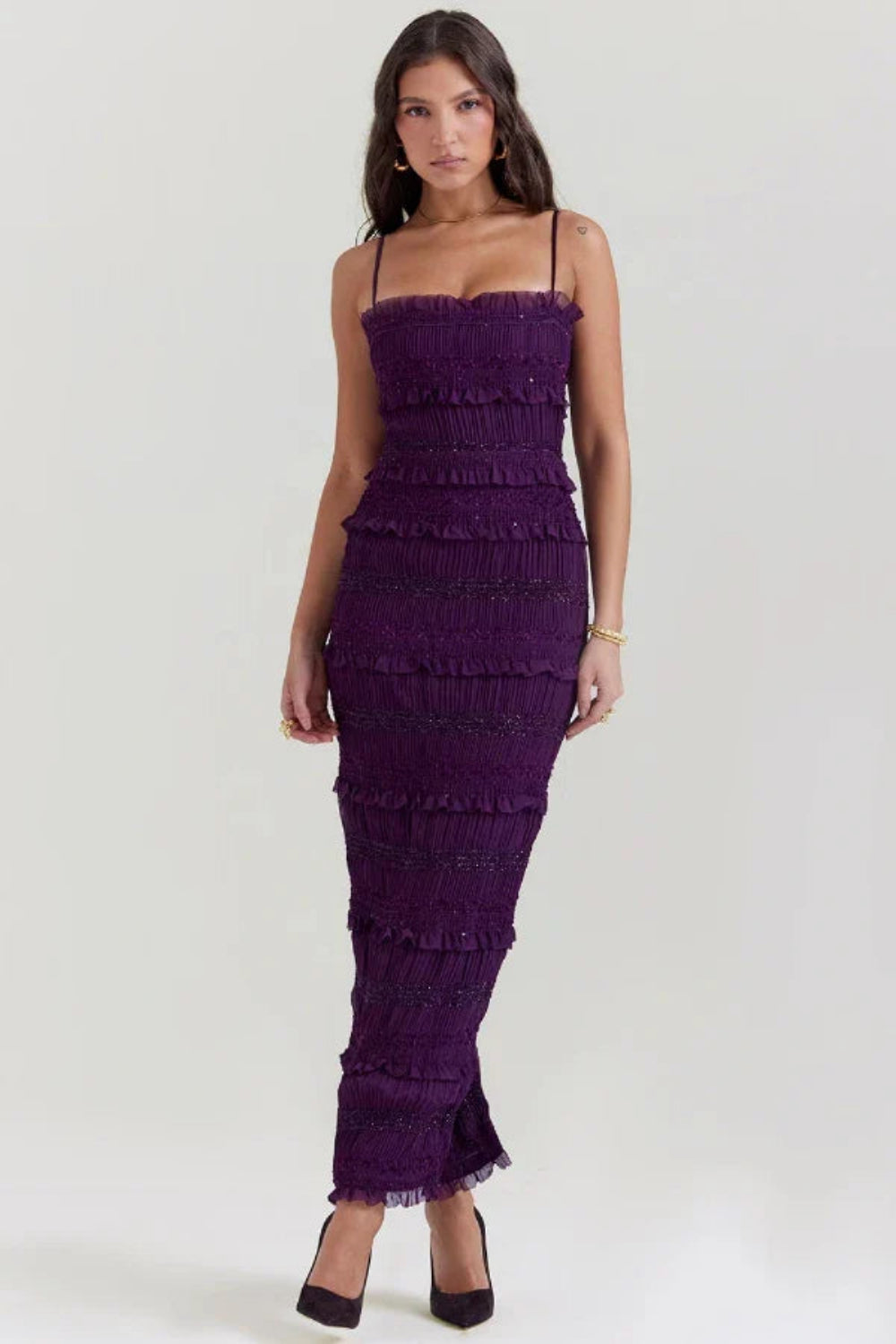 Model wearing the Kouvr Fashion Hannie formal evening jumpsuit in plum purple with tiered ruffles and bead embellishments