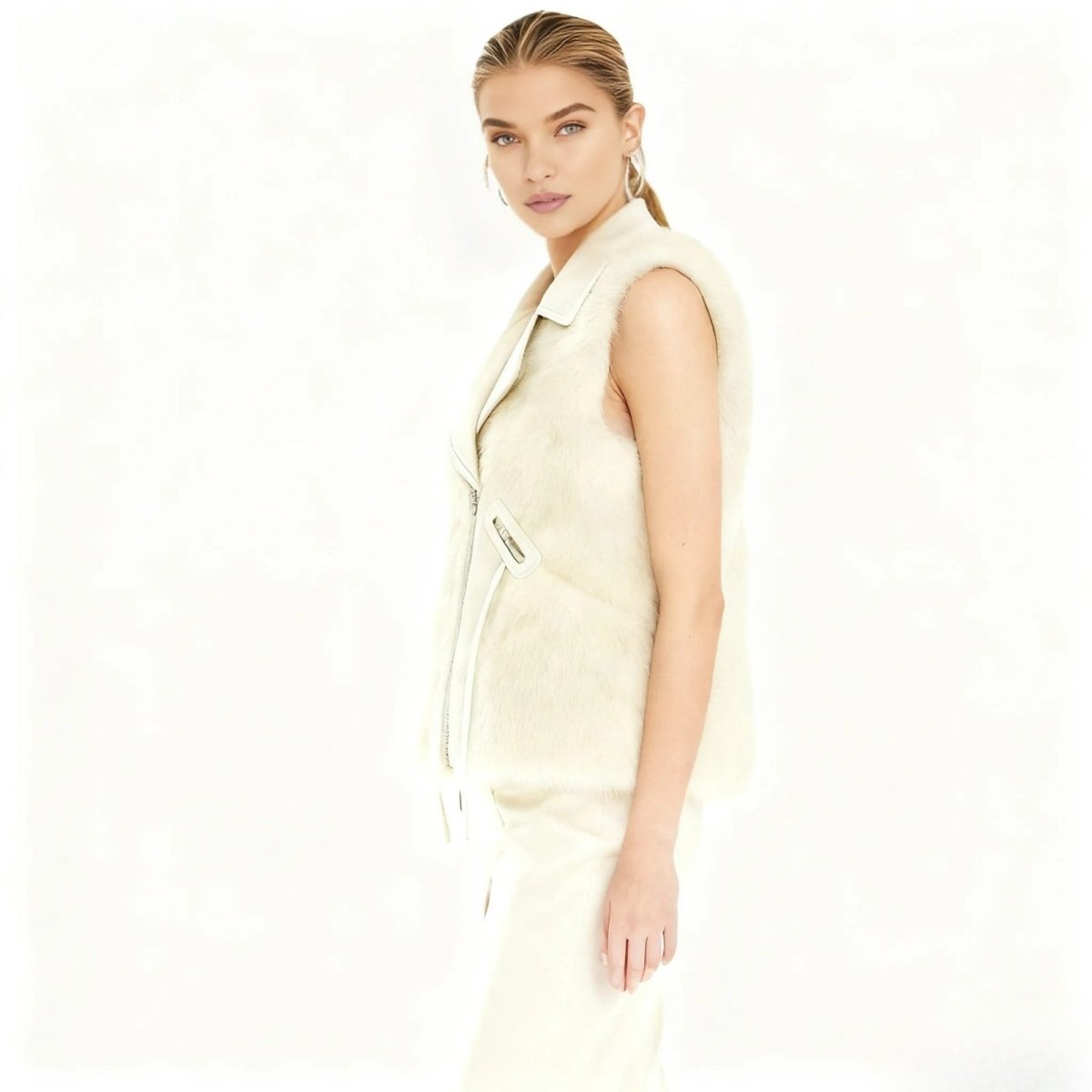 Woman wearing a Ivory Kouvr sleeveless jacket on a white background