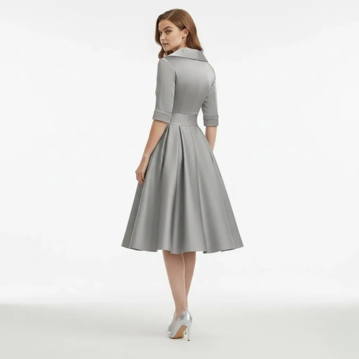 Back view of a model wearing the Kouvr Fashion Jenner grey satin midi dress, showing the collar detail and back zipper.