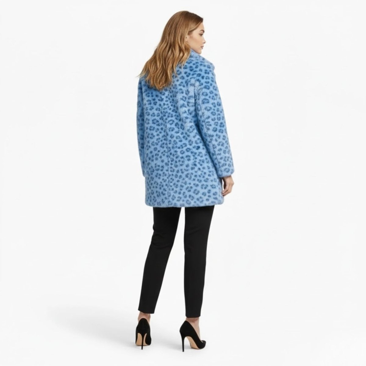 Back view of a model in the Kouvr Fashion blue animal print teddy coat, highlighting the continuous leopard pattern and overall shape.