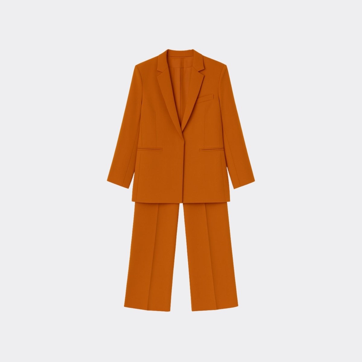 Flat lay of the two-piece kate orange women's suit by Kouvr Fashion, showing the single-breasted blazer and matching wide-leg trousers on a light background.
