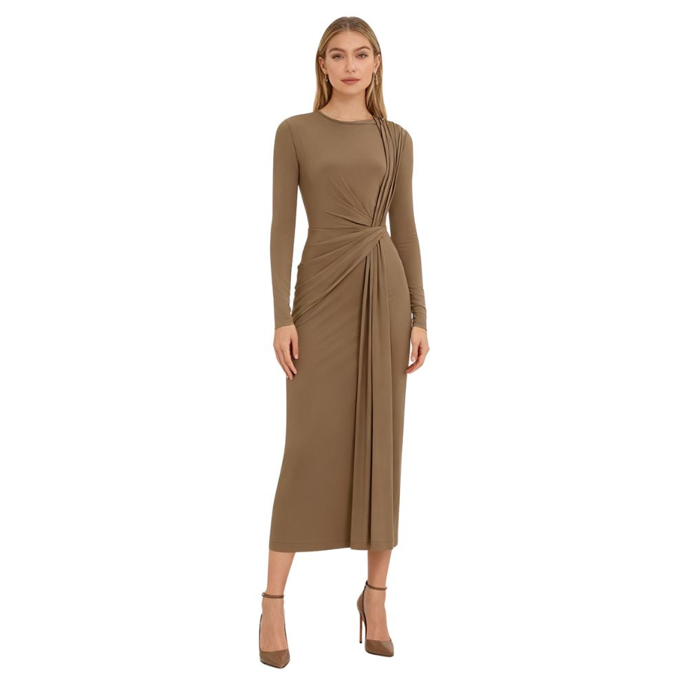 Woman wearing a khaki kouvr dress with a white background