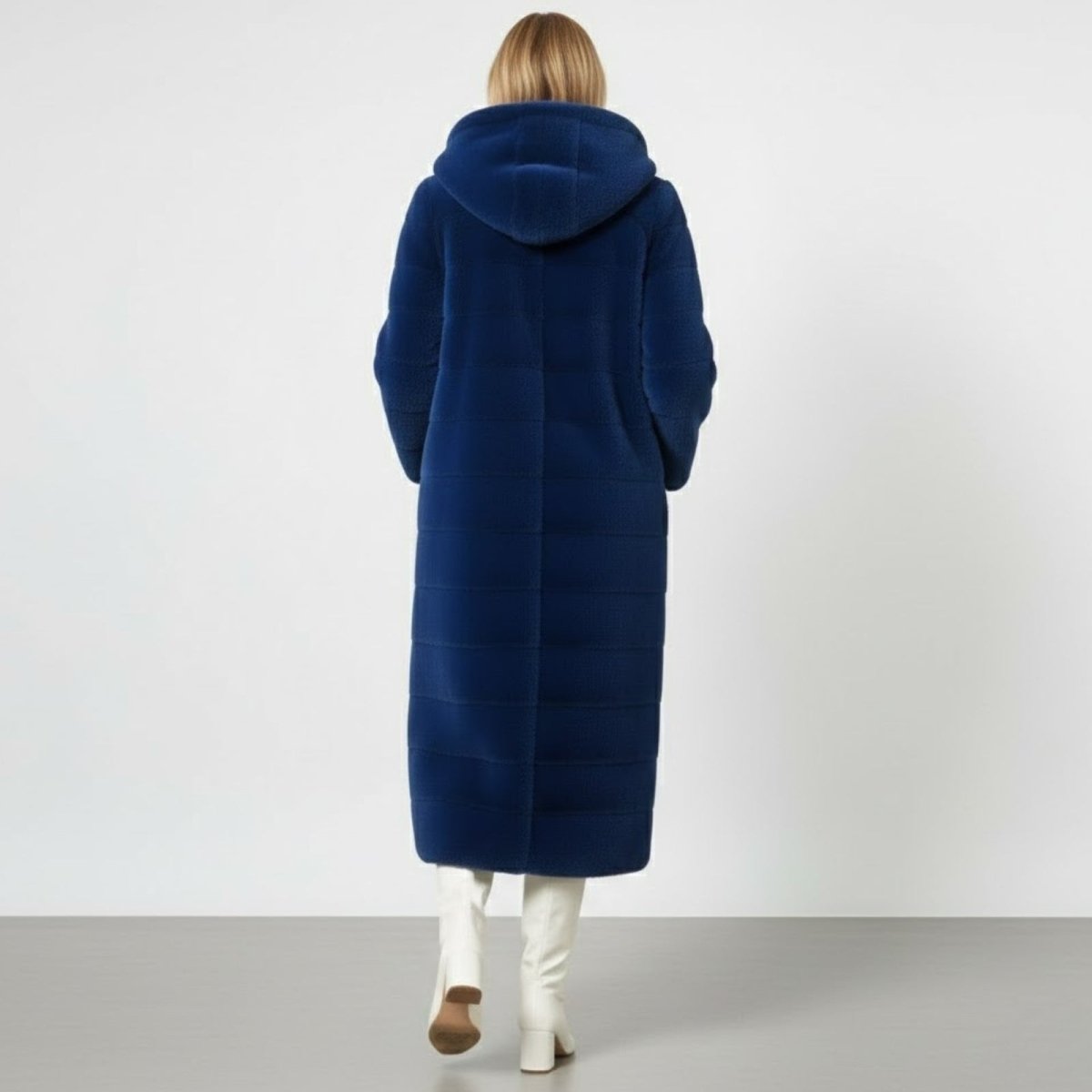 Back view of the Luisa royal blue faux fur coat with its oversized hood, showing the full-length silhouette.