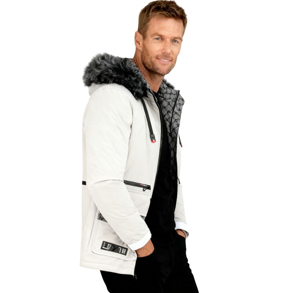 Man wearing a white  kouvr jacket with a fur-lined hood on a white background