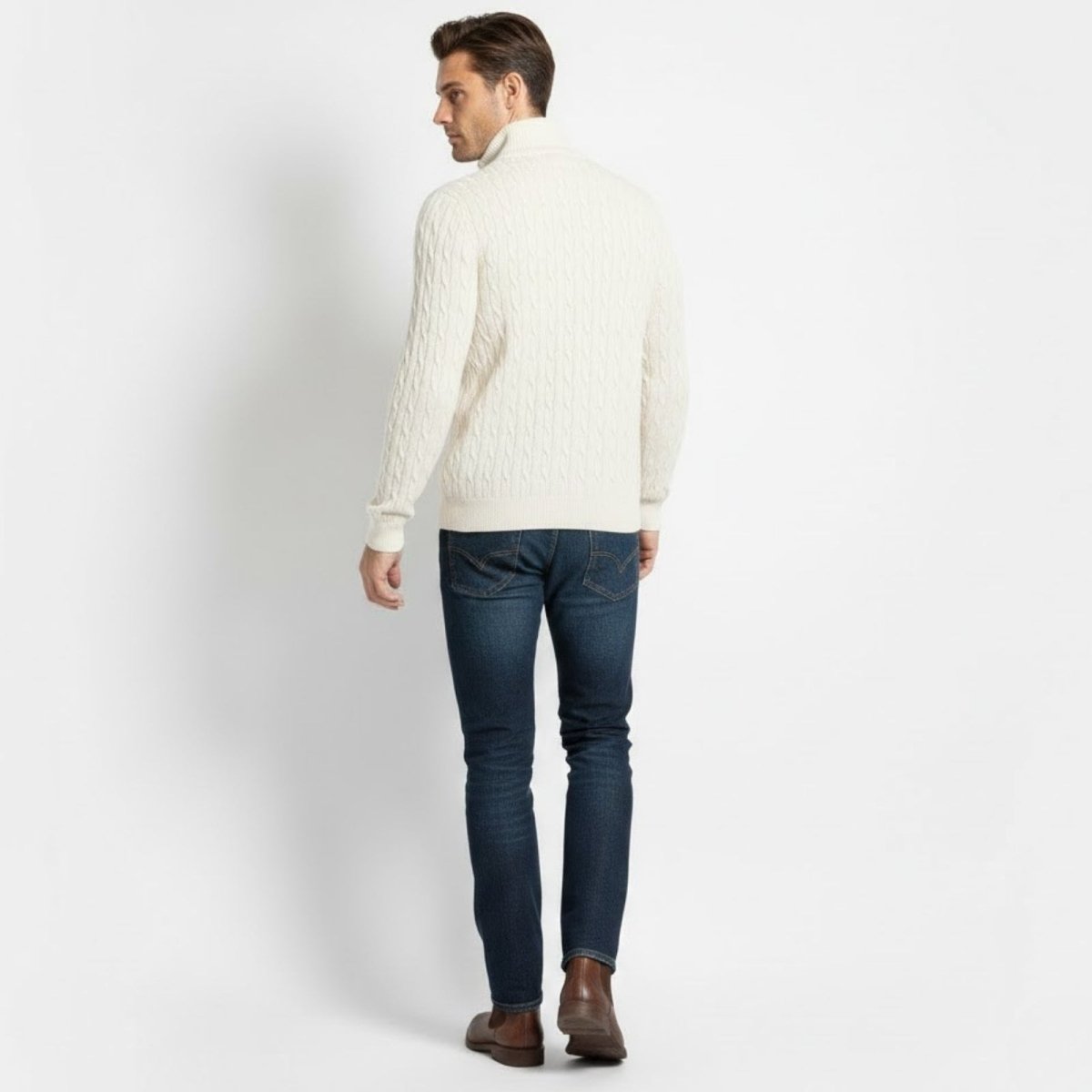 Rear view of a male model wearing the Kouvr Fashion white cable-knit half-zip sweater.