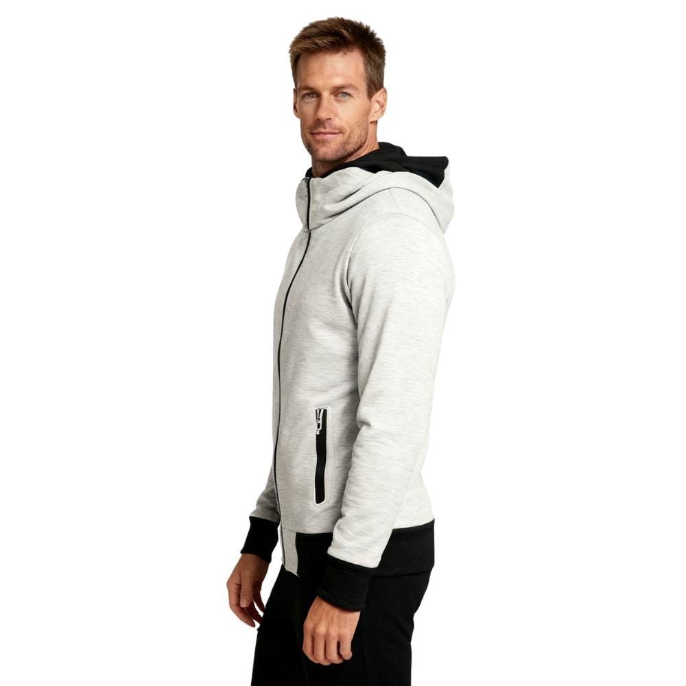 Man wearing a beige kouvr hoodie with black accents on a white background
