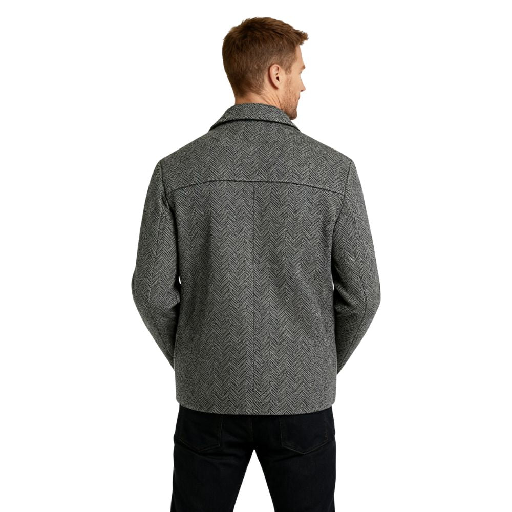 Man wearing Kouvr Fashion gray herringbone wool car coat over a white turtleneck