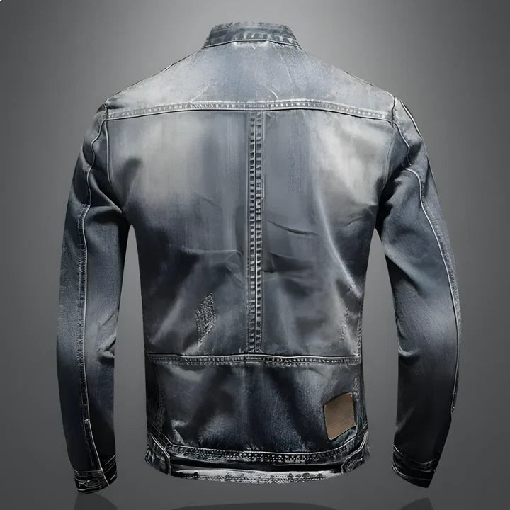 Kouvr denim jacket with a distressed back design on a gray background