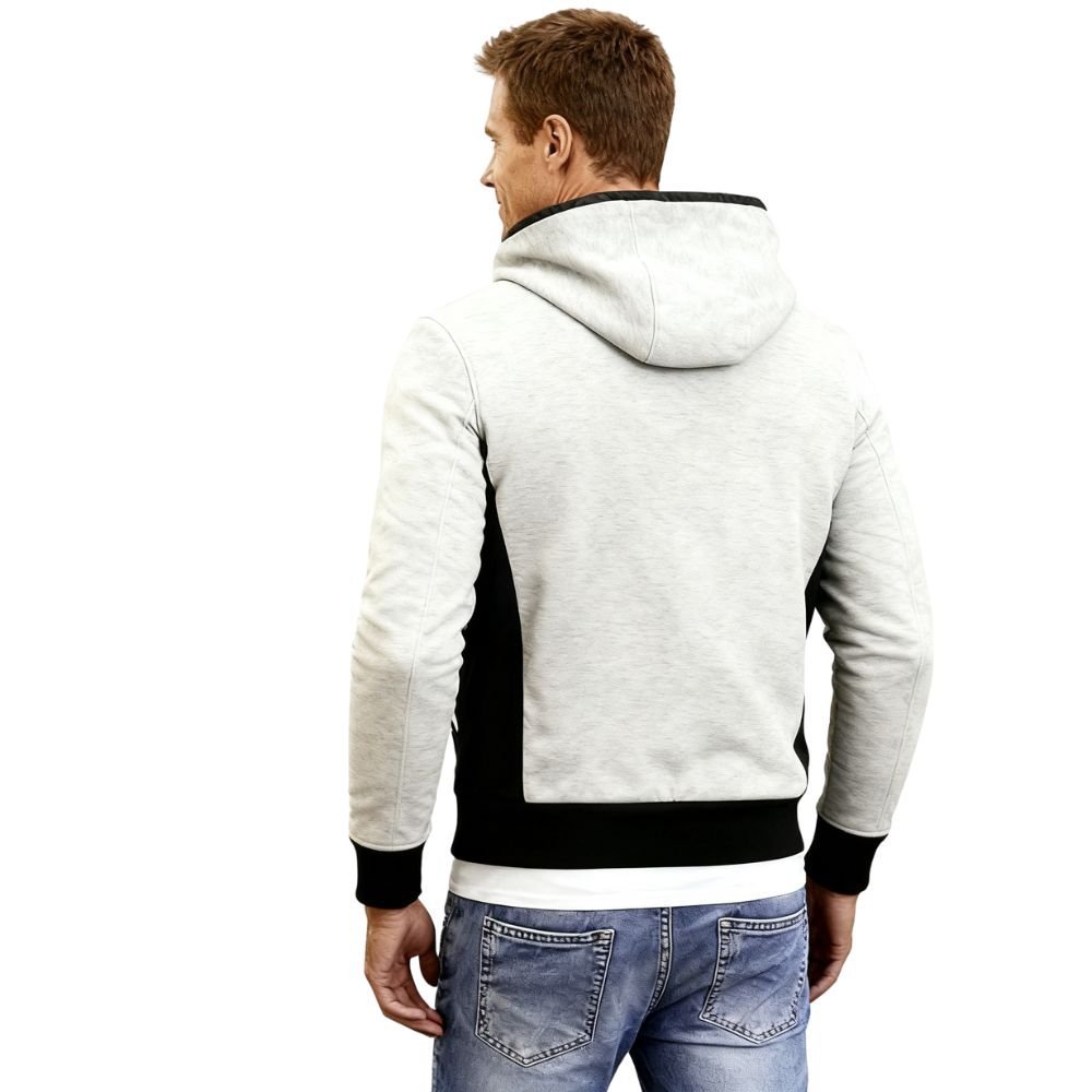 Man wearing a gray and black kouvr hoodie on a white background