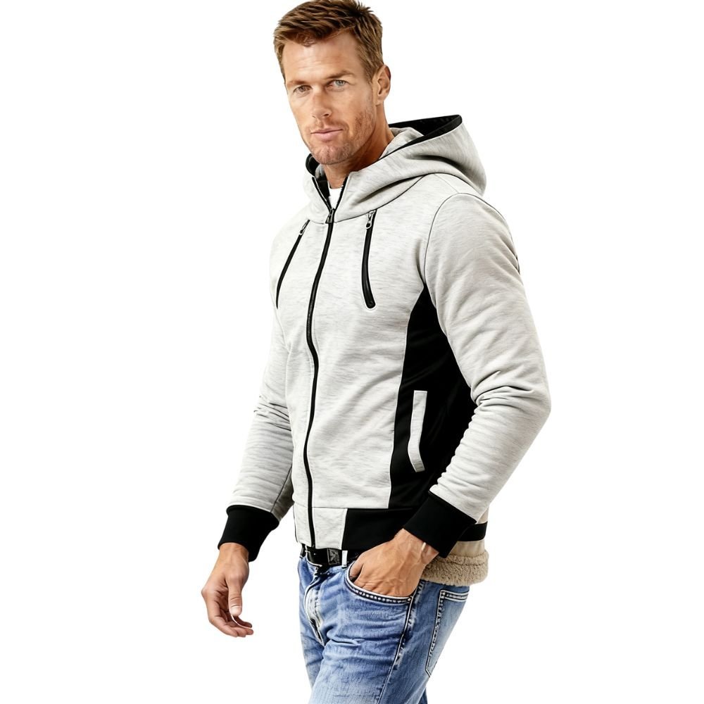 Man wearing a gray and black kouvr hoodie with a white background
