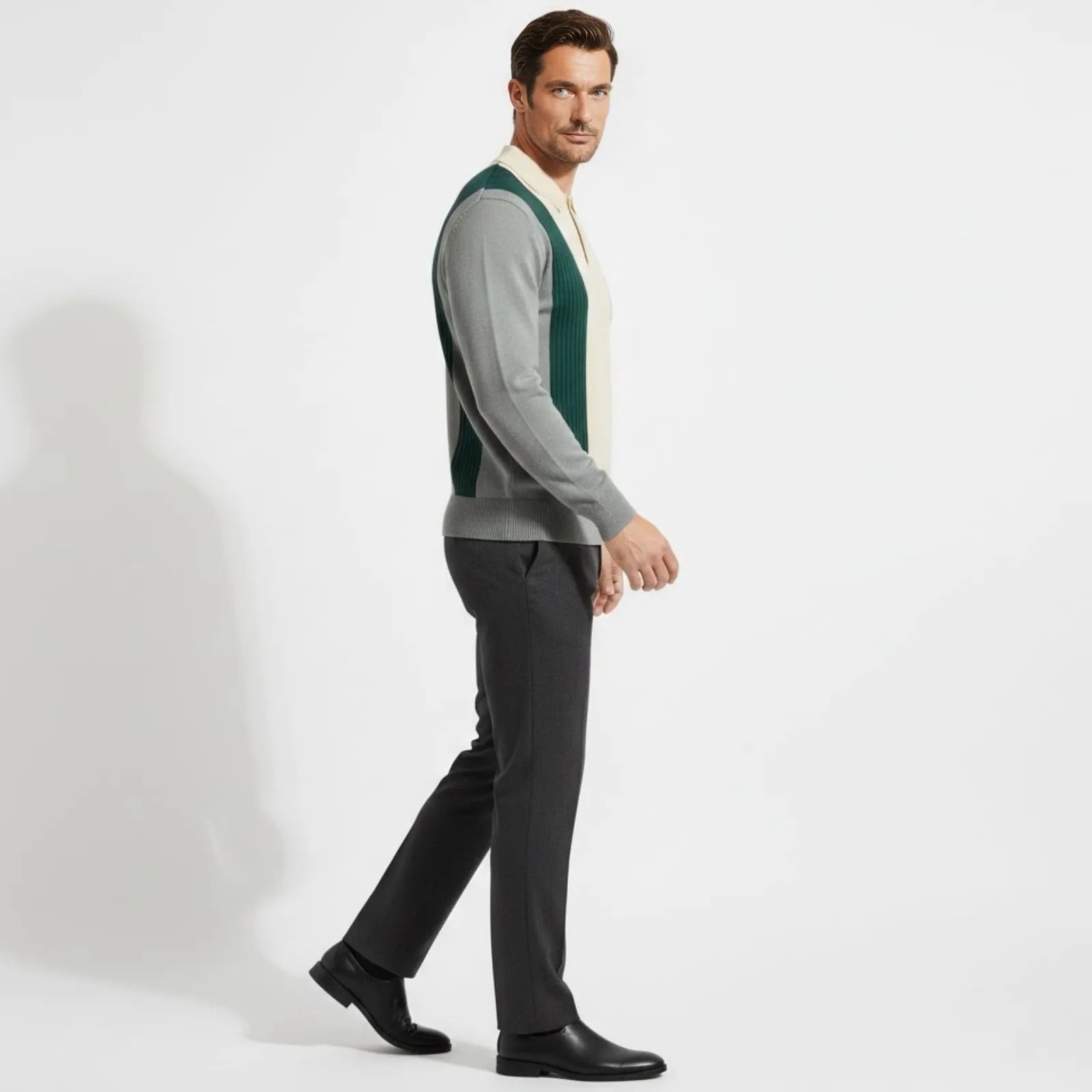 Side profile of a man walking in the Kouvr Fashion long sleeve vintage-style knit polo, showing the fit and sleeve design.