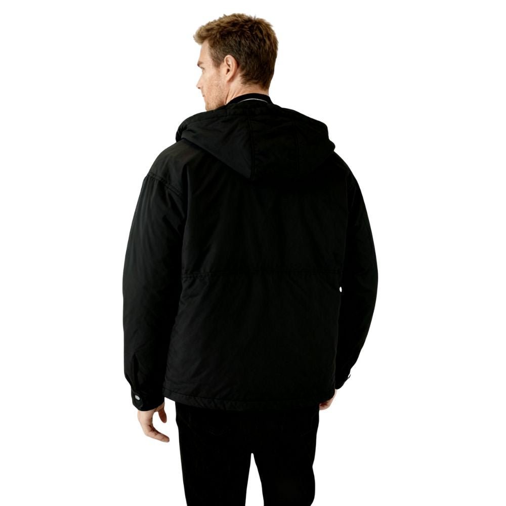 Person wearing a black kouvr jacket on a white background
