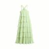 Green Kouvr dress with ruffled layers on a plain background