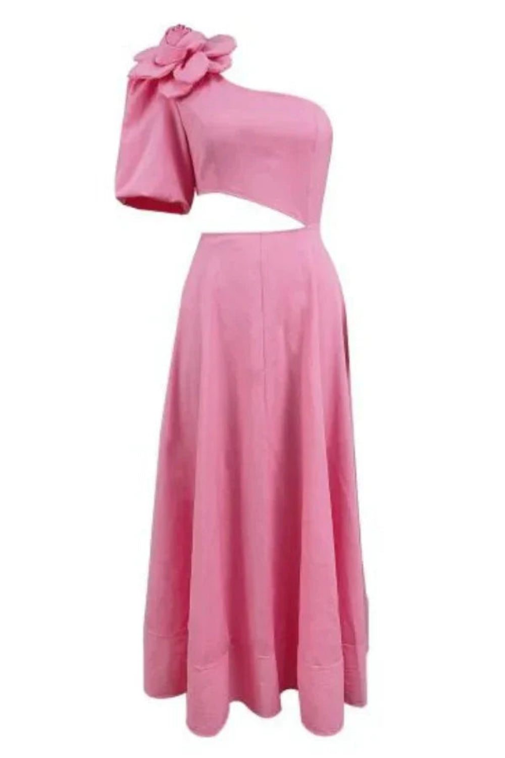 Model wearing Kouvr's pink one-shoulder midi dress with a large rose on the shoulder and a side waist cutout, standing by a pool at night